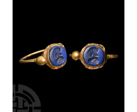 3rd-7th century A.D. Flat-section hoop with cup bezel, and lateral bulb; inset lapis lazuli cloison with intaglio female bust