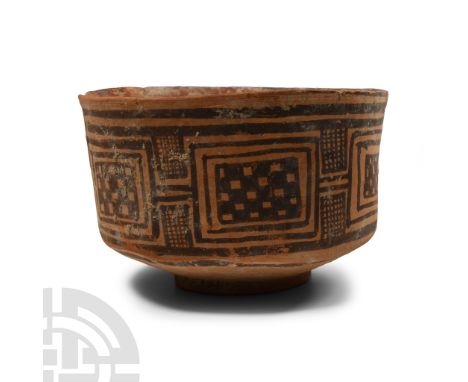3rd-2nd millennium B.C. Squat vessel with carinated profile and basal ring, painted bands of geometric panels and hatching.  