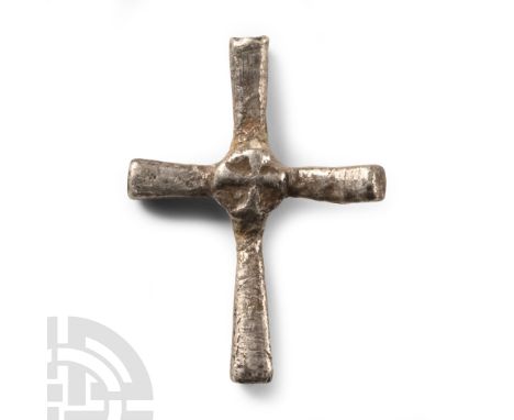 Circa 6th-8th century A.D. Cruciform amulet with expanding arms, disc to the centre with low-relief cross symbol.  1.45 grams