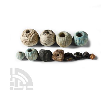 6th-8th century A.D. Including aqua glass melon beads, mosaic glass spherical beads and other types.  47 grams total, 7-24 mm