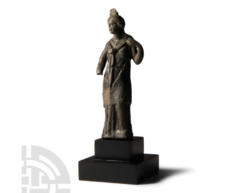 1st-3rd century A.D. The goddess standing, wearing an Ionic chiton and himation secured by a characteristic knot tied between