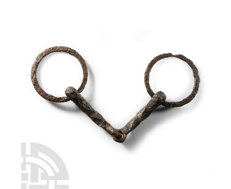 1st-4th century A.D. Comprising a pair of twisted iron bars linked at the centre, loop at each outer end with free-running fl
