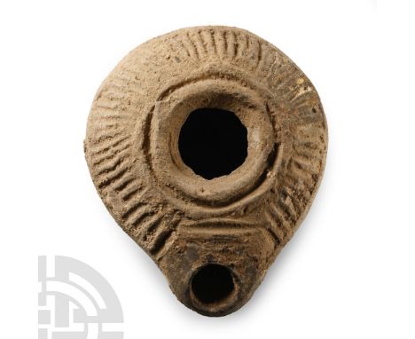 Circa 4th-6th century A.D. Teardrop-shaped in plan with ribbed shoulder and small nozzle, basal ring.  55.6 grams, 73 mm (2 7