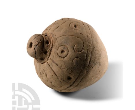 9th-11th century A.D. Piriform body with band of impressed scrolls and rings to the shoulder, domed filler-hole, intended to 