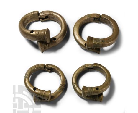 19th century A.D. Group of four hinged bracelets with clubbed ends, pointillé and other detailing; pierced to accept a fasten