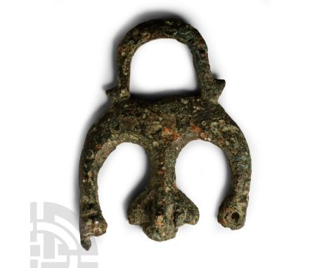 1st-2nd century A.D. Amuletic fascinum formed as a crescent with phallus to the right, hand in the fica gesture to the left a