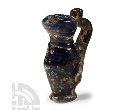 3rd-4th century A.D. Lamp-work glass miniature ewer with applied strap handle.  4.19 grams, 29 mm (1 1/8 in.). Acquired from 