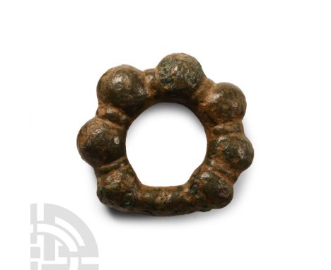 1st century B.C.-1st century A.D. Comprising a round-section expanding shank, segmented bulbs. See discussion in Spratling, M