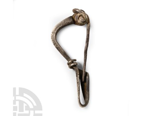 2nd century B.C. Bow brooch of La Tène type II with returned foot and simple coiled spring to the head, integral pin. Cf. Hat