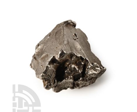 Fell 12th February 1947 A.D. Sikhote Alin meteorite in a drum-shaped capsule.  13.7 grams, 18 mm (3/4 in.). Acquired from Ste