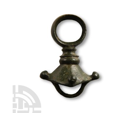 Circa 1st century A.D. Comprising a substantial ring mounted on a short neck with tiered collars and facetted flared flange b