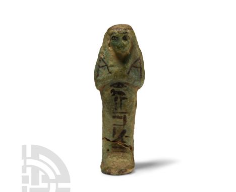 21st Dynasty, 1077-943 B.C. Applied black pigment to the wig, eyes, two hoes, seed bag at the reverse, and a vertical panel o