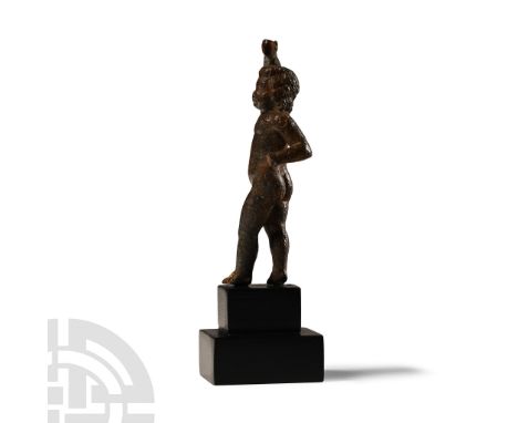 1st-2nd century A.D. Modelled in the round, standing nude with one arm raised above the head and the other bent, probably fro