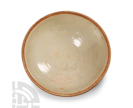 Tang Dynasty, 618-907 A.D. or later. Of low ogee profile with unglazed rim, basal ring.  187 grams, 14.5 cm wide (5 3/4 in.).