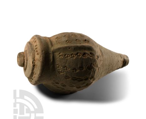 14th century A.D. Piriform body with radiating vertical lugs to the shoulder and decorated panels between, tiered neck, domed