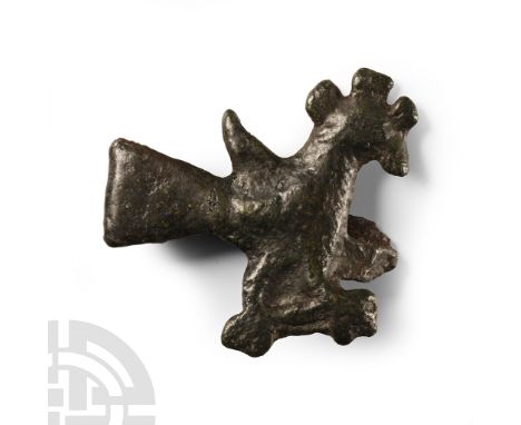 10th-12th century A.D. Modelled in profile with radiating tripartite crest, triangular stub wing, splayed feet, catch and pin