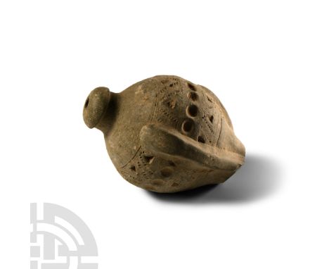 9th-11th century A.D. Piriform body with lateral ribs and impressed ornament to the upper body, domed filler-hole, intended t