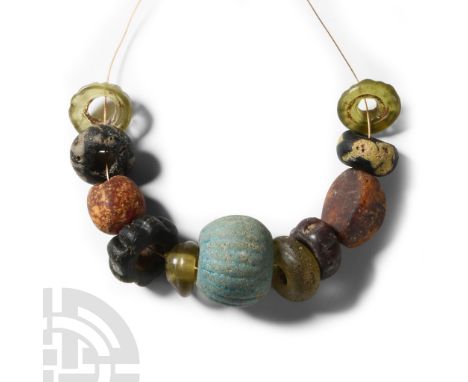 6th-8th century A.D. Restrung group of annular, melon, oblate and other types in various colours.  21 grams, 97 mm (3 3/4 in.
