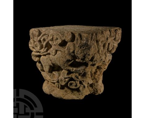 Bordeaux, 12th century A.D. Square in plan with round base and expanding trunk decorated on two faces with dense scrolled fol