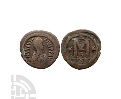 491-518 A.D. Obv: DN ANASTASIVS PP AVG, pearl diademed, draped, cuirassed bust right. Rev: large M, star to left, cross above