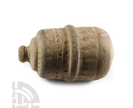 13th-14th century A.D. Drum-shaped body with stepped profile, bands of impressed rosette and other detailing, domed filler-ho