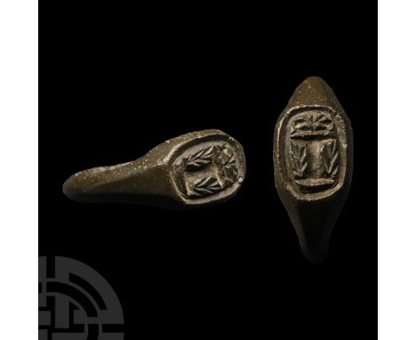 14th-16th century A.D. With D-section hoop, tapering shoulders, sub rectangular bezel with reserved capital 'I' between frond