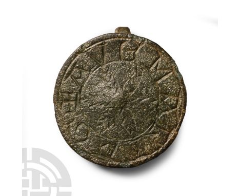 13th-14th century A.D. Comprising a disc with radiating fronds surrounded by a band with legend '+ AVE MARIA G'; applied bar 
