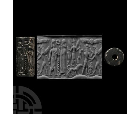 Early 2nd millennium B.C. Haematite with a robed figure with beard and cap facing a robed female(?) with hands raised, rosett