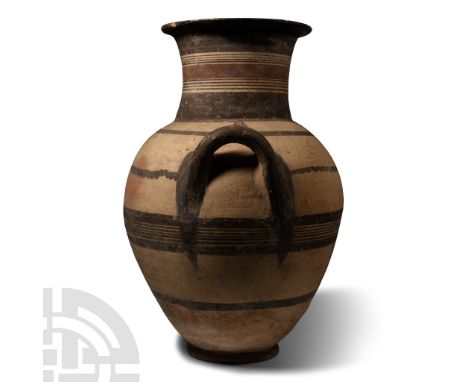 Iron Age, Cypro-Geometric, 950-850 B.C. With narrow base, oblate profile, two lateral loop handles to the shoulder, broad nec