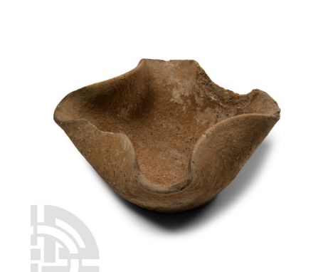 Early Bronze Age I, circa 3000 B.C. Squat in profile with four pinched and folded spouts to the rim, broad base.  211 grams, 