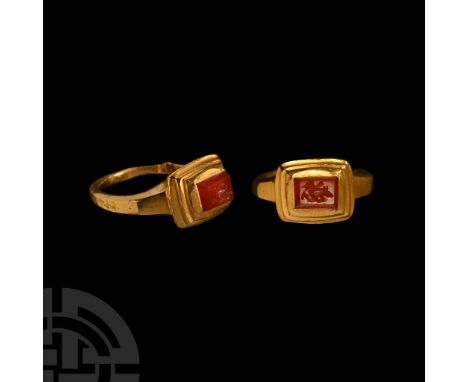 7th-10th century A.D. and earlier. Substantial ring with D-section hoop, tiered bezel with inset 4th-5th century A.D. carneli