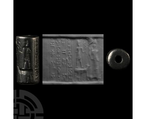 Late 3rd millennium B.C. Haematite with the weather and storm god Adad standing of his symbol animal (the bull), holding in h