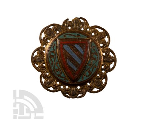 Limoges, circa 1300 A.D. Parcel-gilt plaque from a coffre, with openwork foliage border, central disc with raised heater shie