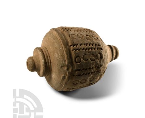 14th century A.D. Piriform body with vertical bands of pellets and roundels, knop finial, tiered and domed filler-hole, inten