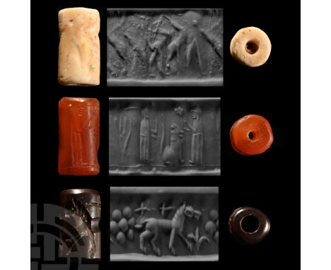 Circa 2300-2200 B.C. and later. Comprising: an Akkadian example with a heroic scene carved in shell, accompanied by an old sc