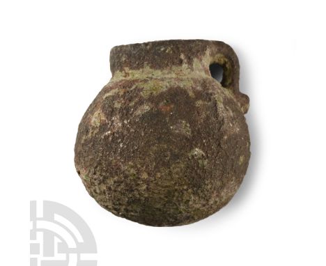 13th-16th century A.D. Of globular form with low neck, loop handle with spur; textured outer face. Cf. Forsyth, H. &amp; Egan