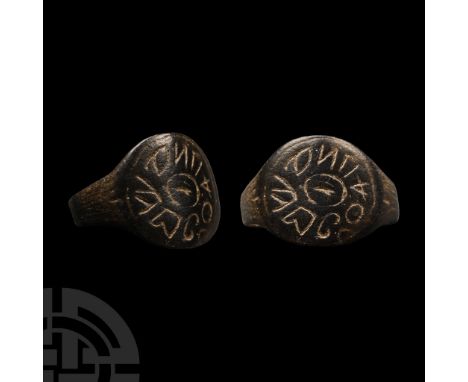6th-8th century A.D. With broad disc bezel and shank formed from two lateral arms; low-relief central ring with pseudo-text i