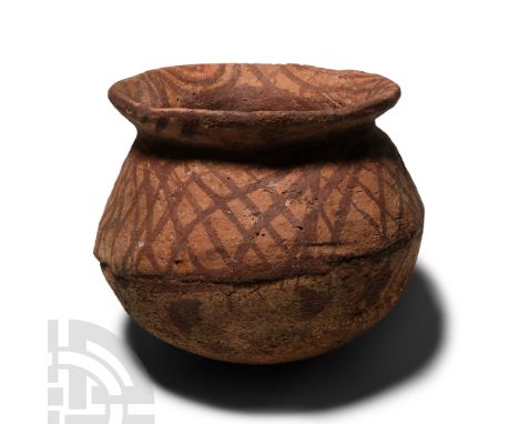 Bronze Age, circa 2nd millennium B.C. Of biconvex profile formed with a rounded base and flared shoulder, everted rim; applie
