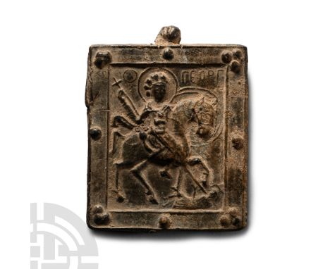 Circa 7th century A.D. Bifacial lead plaque with figurative decoration: obverse with Saint George, nimbate, on his horse kill
