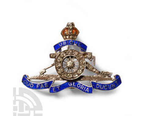 1940s A.D. Cap-badge of the Royal Artillery in silver with enamel scroll and inset glass studs.  5.94 grams, 41 mm (1 1/2 in.