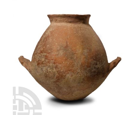 Early Bronze Age I, 3rd millennium B.C. Biconvex globular body with broad neck, everted rim, two ledge handles below the equa