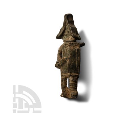 1st-3rd century A.D. Plate brooch formed as an advancing gladiator with large rectangular shield, triangular helmet, gladius 
