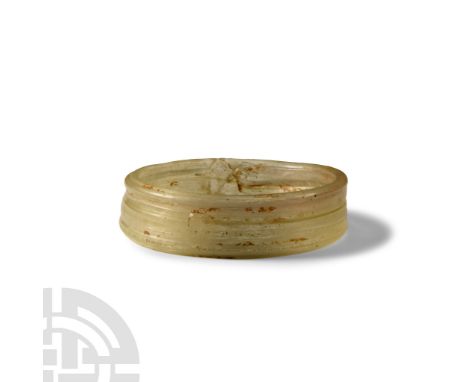 5th-7th century A.D. Aqua-coloured glass lamp-work bangle with ribbed construction. Cf. fragment of a similar item in the Bri