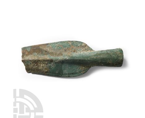 Circa 1000 B.C. With broad leaf-shaped blade and tapering socket extending to the midrib; socket pierced to accept attachment
