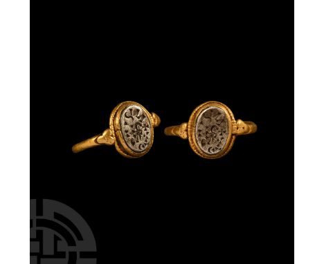 Italy, 5th-7th century A.D. Round-section hoop with applied granule trefoil to each shoulder, ellipsoid bezel with beaded wir