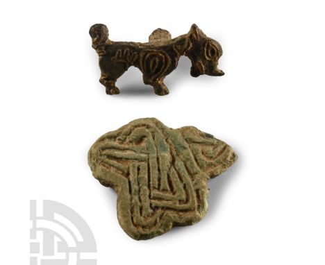 6th-8th century A.D. Comprising: a zoomorphic mount with raised detailing, stud to reverse; fragment with high-relief interla