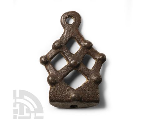 9th-11th century A.D. Lozenge-shaped piercings and raised pellets to the body, a single piercing to both terminals. Cf. Willi