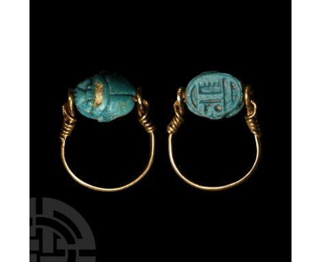 Late Period, 664-332 B.C. and later. Scarab with detailed carapace and legs, impressed hieroglyphs to the underside; set in a