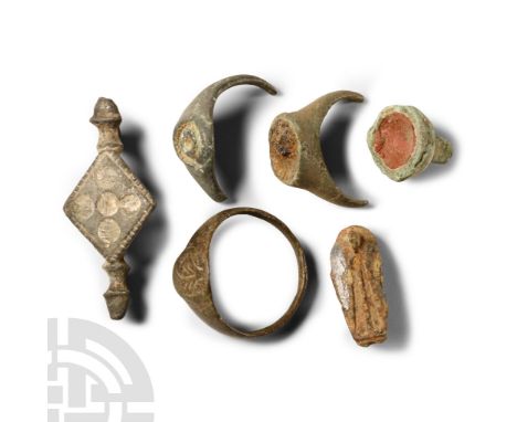 1st-4th century A.D. Including an equal-ended plate brooch, finger ring and fragments.  13.6 grams total, 12-33 mm (1/2 - 1 1