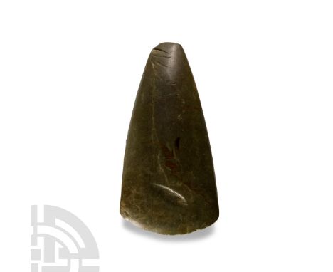 Neolithic Period, 4,000-3,500 B.C. Of teardrop shape in polished greenstone with broad curving cutting edge, lentoid-section 
